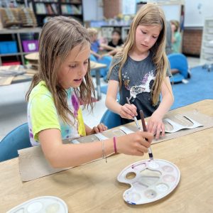 two girls painting