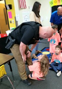 Community partners, law enforcement and school officials deliver tshirts