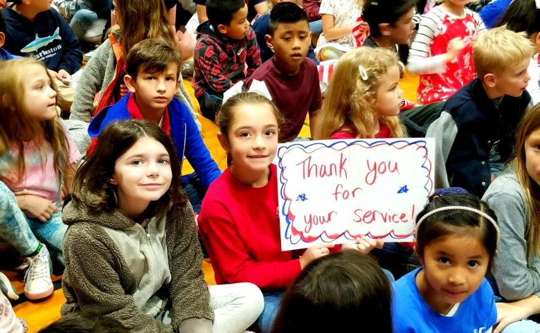 Students with signs of appreciation