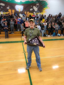Mr. Wayne Buckner holding flag