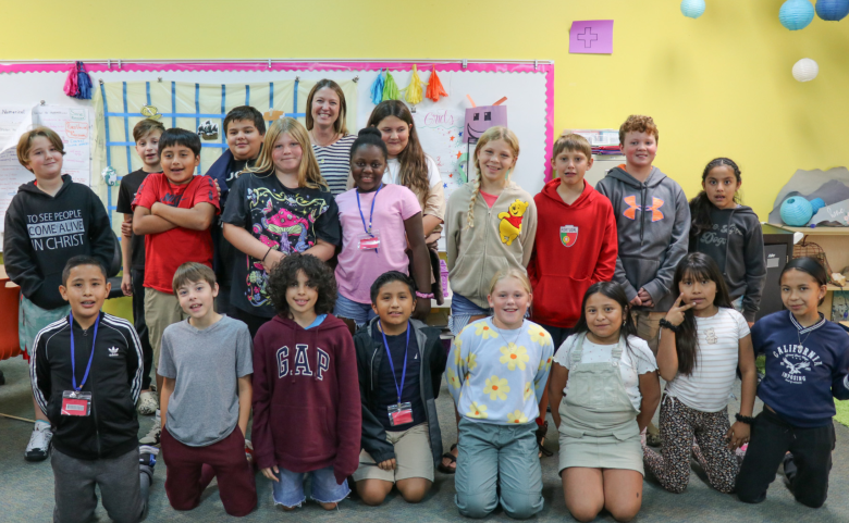Ms. McMunigle and 19 students pose for a photo.