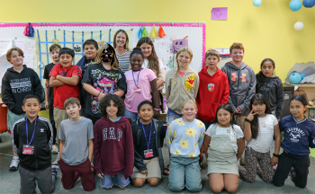 Ms. McMunigle and 19 students pose for a photo.