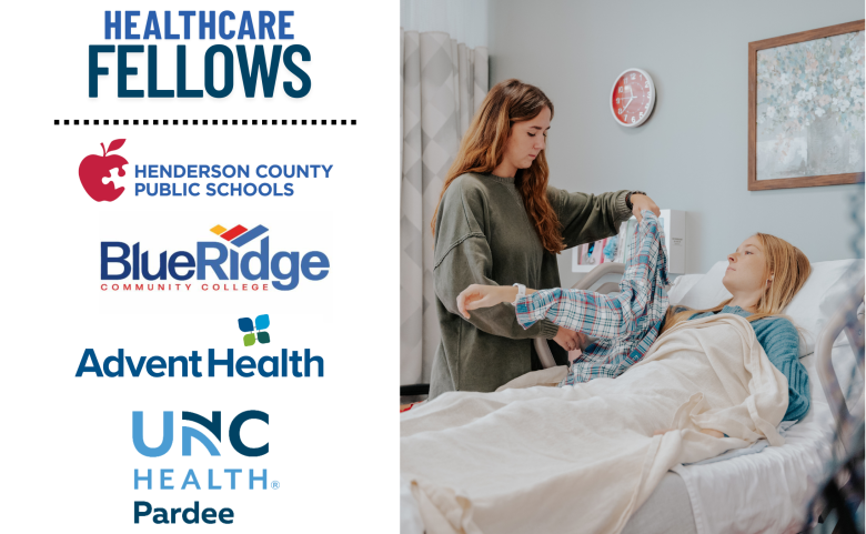 An informational graphic about the Healthcare Fellows program features a split design. On the left, bold blue text reads 'HEALTHCARE FELLOWS' above a dotted line, followed by the logos of Henderson County Public Schools, Blue Ridge Community College, AdventHealth, and UNC Health Pardee. On the right, a photograph captures a hands-on healthcare training scene. A young woman with long brown hair, wearing a green sweater, assists another young woman lying in a hospital bed. The patient, dressed in a blue sweater and covered with a beige blanket, is receiving care as the standing woman lifts her leg in a physical therapy exercise. The setting resembles a clinical training environment, with a red wall clock and framed artwork in the background.