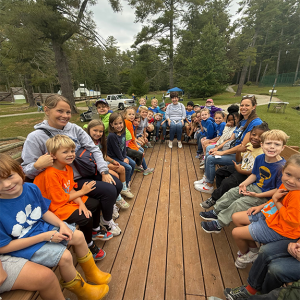 A wagon full of students looking at the camera.