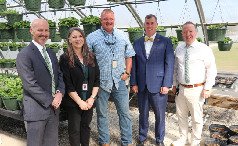 Mr. Rollins poses for a photo with Dr. Carl Taylor, Dr. Shannon Marlowe, Superintendent Mark R. Garrett, and East Principal Brandon Scott.